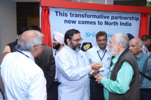 8 L R Dr Chandrasekaran looks on as Suresh Chitturi interacts with people