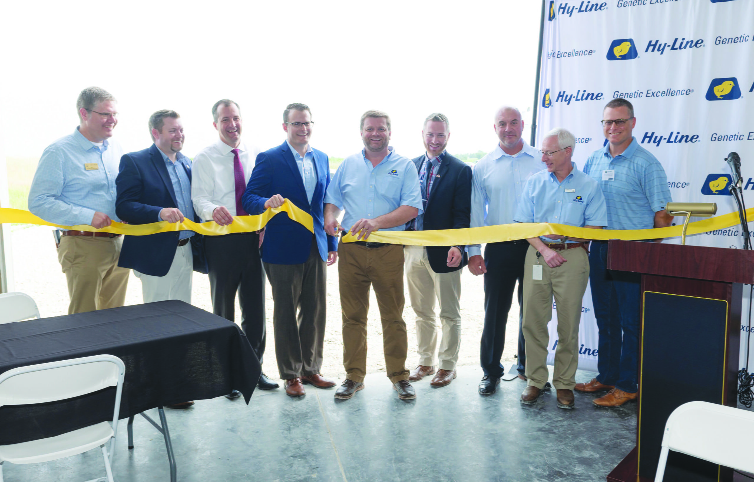 Hy Line International Wallace Farm Ribbon Cutting June 2019 Jonathan Cade Cutting Ribbon with VIPs scaled