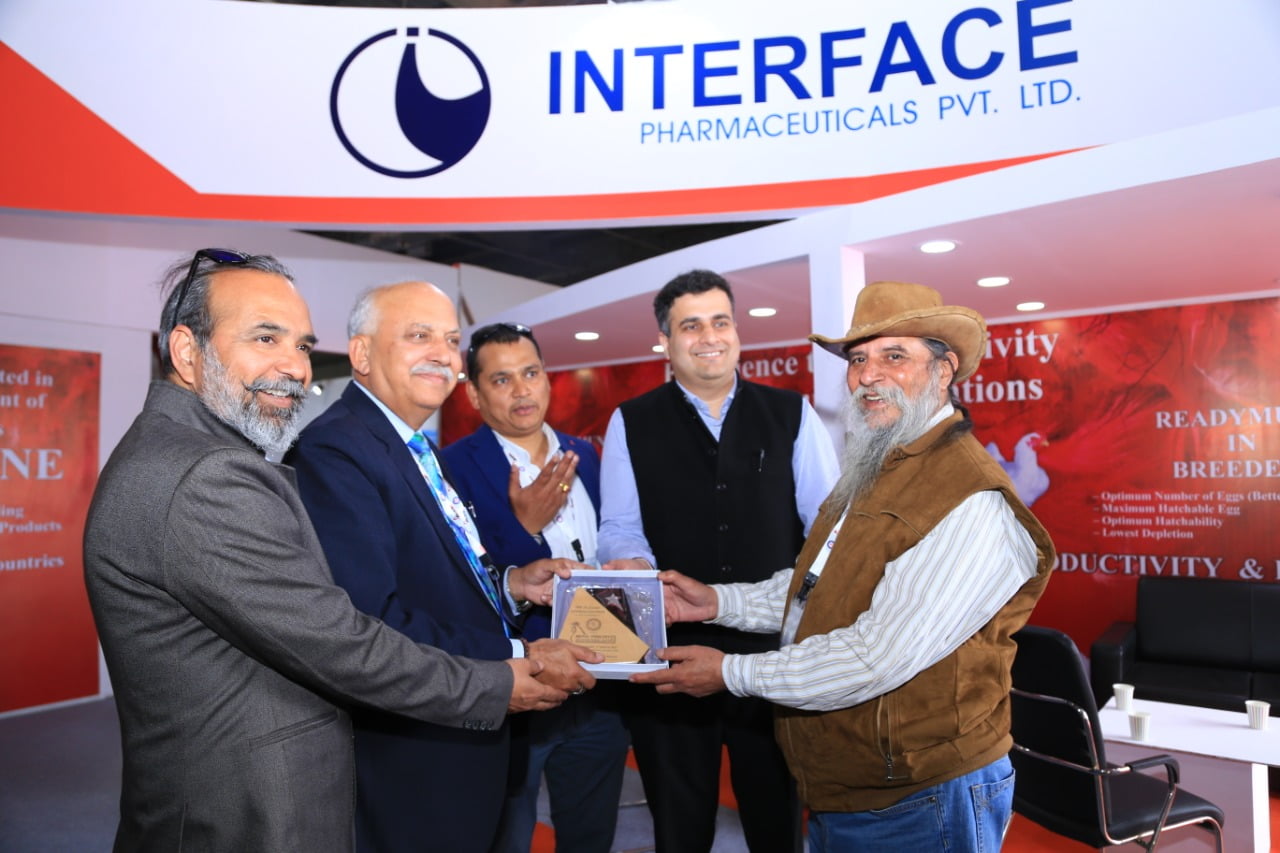 MR. S.K. MALHOTRA RECIEVING TROPHY FOR PARTICIPATION FROM MR. GUNA CHANDRA BISHT POPULARLY KNOWN AS SWAMI JI CHAIRMAN OF AVINASH GROUP AND CHAIRMAN NEPAL POULTRY FEDERATION